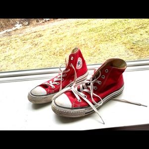 Red high top chuck taylors